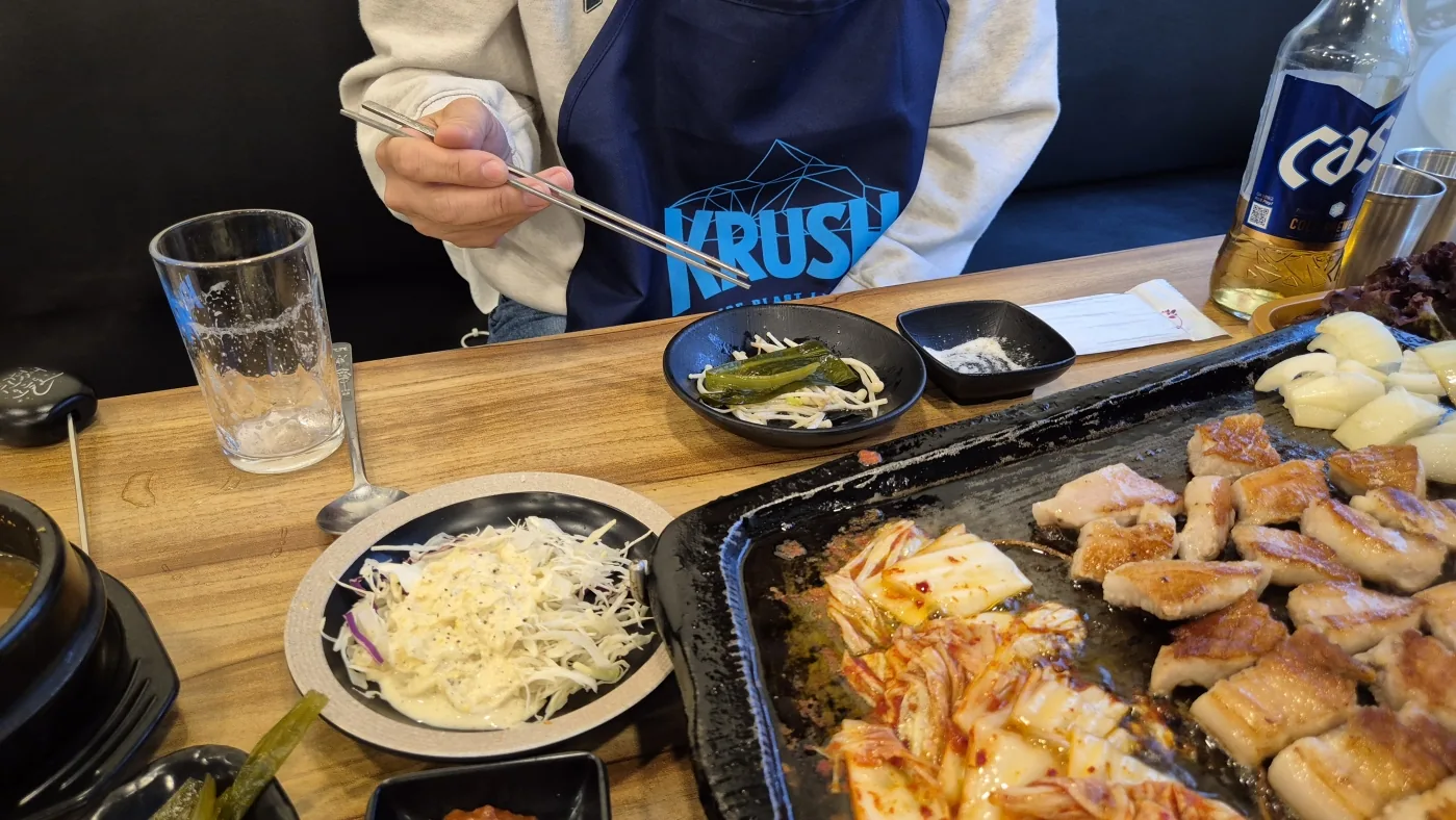 Guests enjoying Korean BBQ together during the hosted Seoul dinner