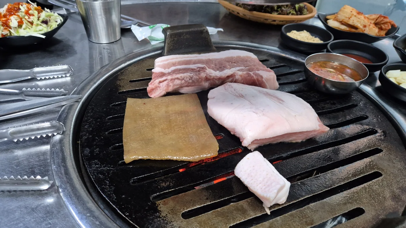Korean BBQ cooking on a tabletop grill during the Seoul experience