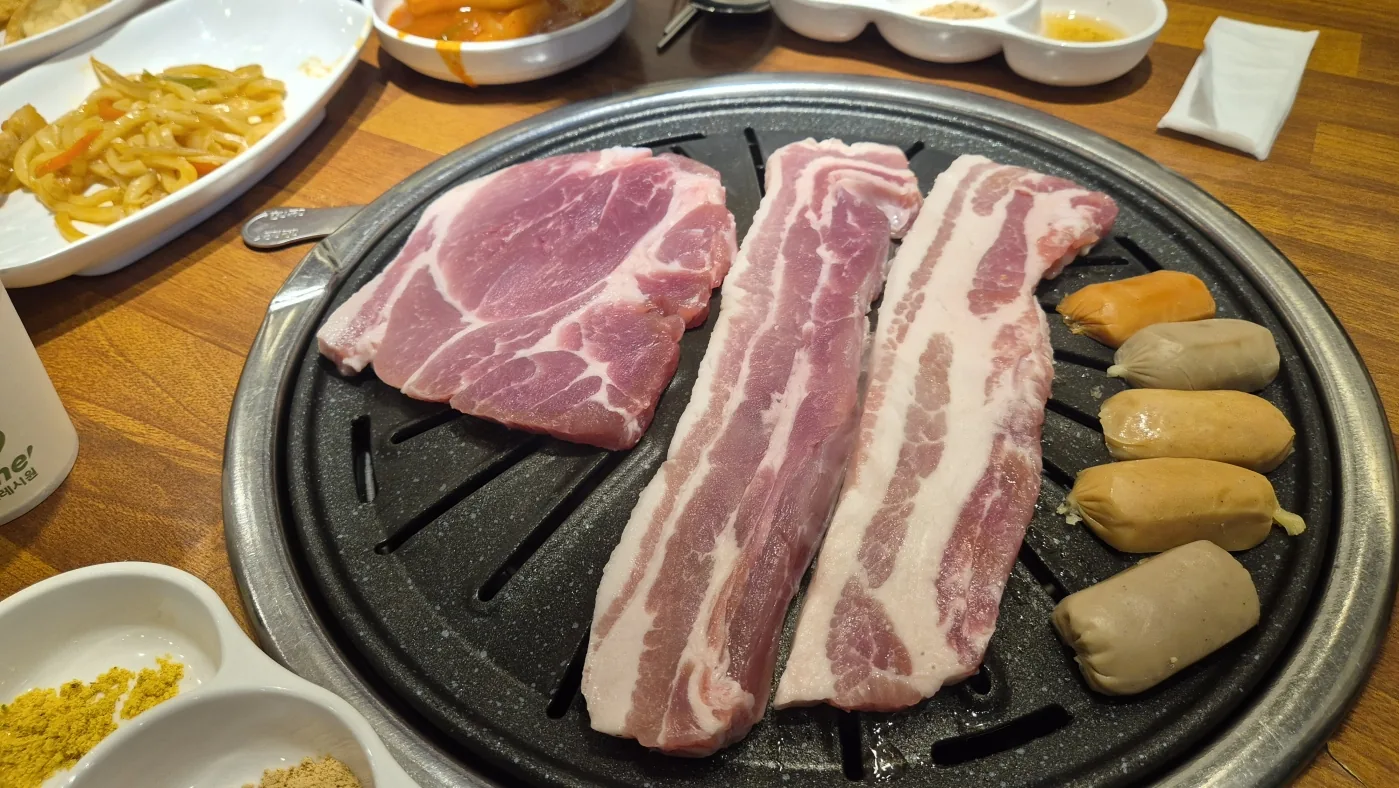 Korean BBQ cooking on a tabletop grill during the Seoul experience