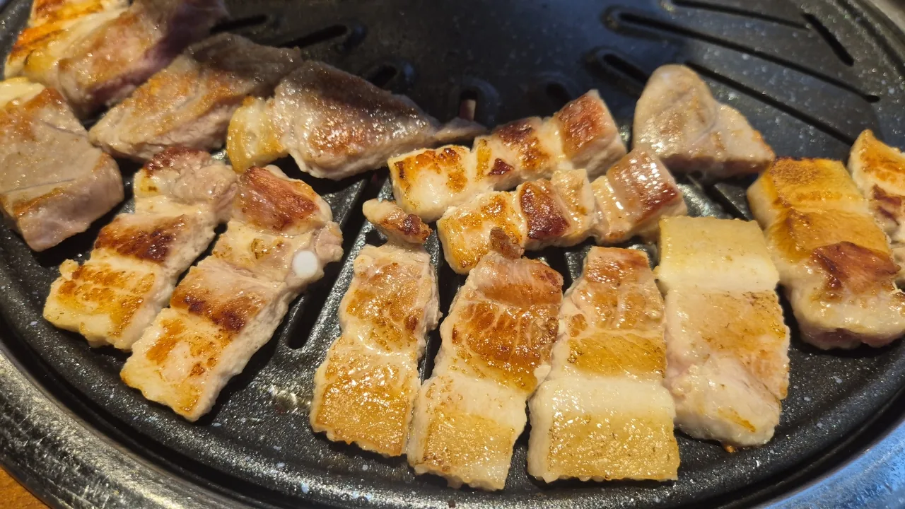 Korean BBQ cooking on a tabletop grill during the Seoul experience