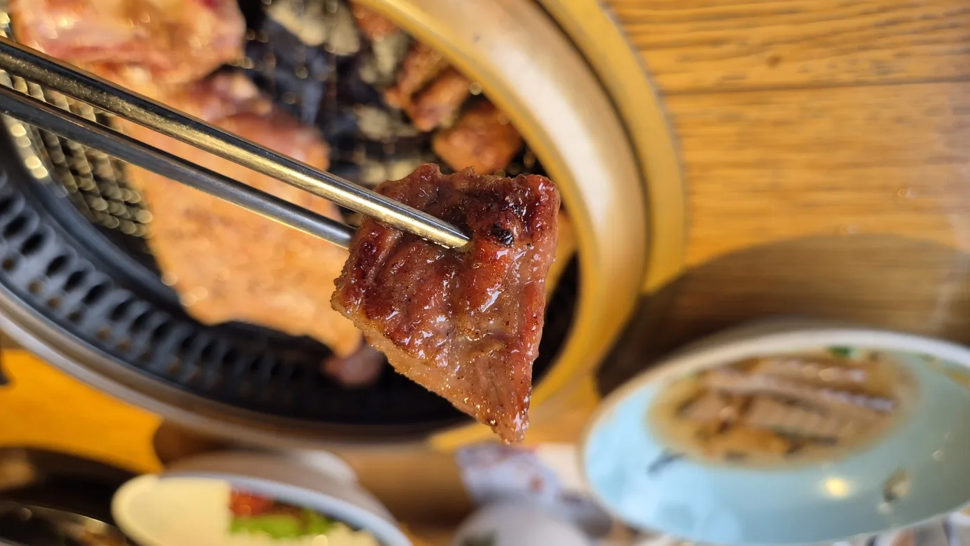 Korean BBQ cooking on a tabletop grill during the Seoul experience